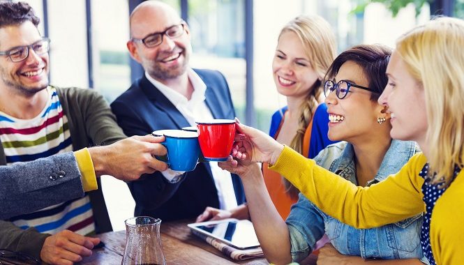 Group of multi-ethnical people celebrating their new start-up business.